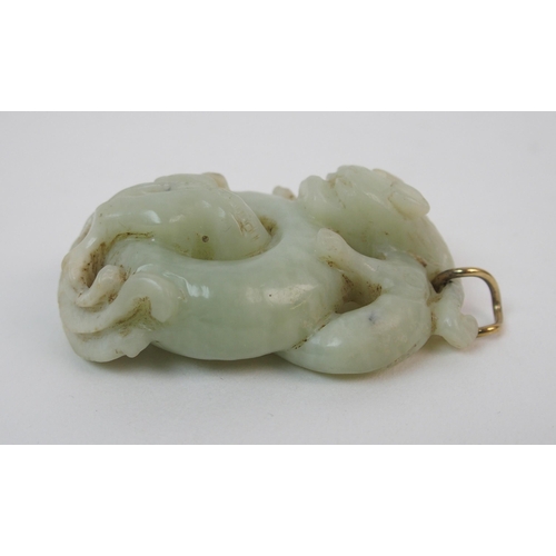 54 - A Chinese jade carving of an entwined dragon