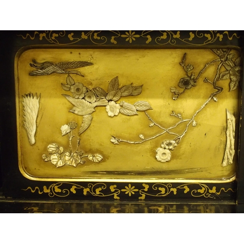 75 - A Japanese black and gold lacquered Shodhana cabinet