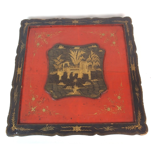 9 - A Chinese black and red lacquered square shaped box