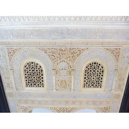 92 - A painted plaster and alabaster Alhambra wall mirror