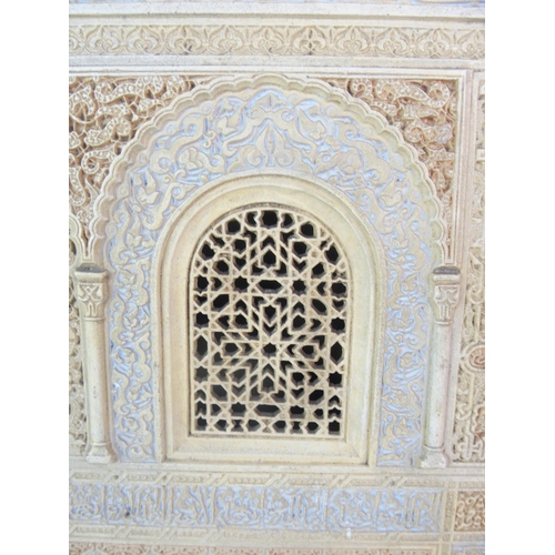 92 - A painted plaster and alabaster Alhambra wall mirror