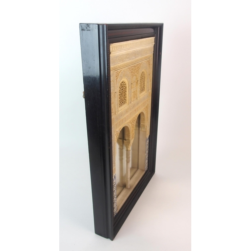 92 - A painted plaster and alabaster Alhambra wall mirror