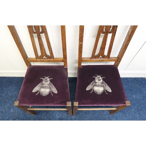 10 - A pair of early 20th century oak Arts & Crafts chairs with stylized fretwork splats on square st... 