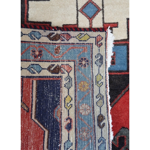 12 - A red ground eastern prayer rug
