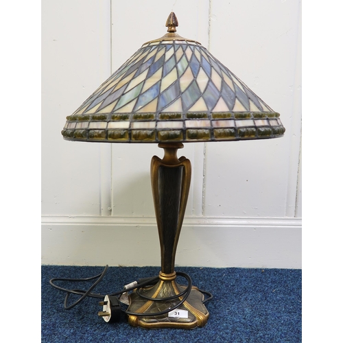 31 - A 20th century Tiffany style table lamp with cast resin base