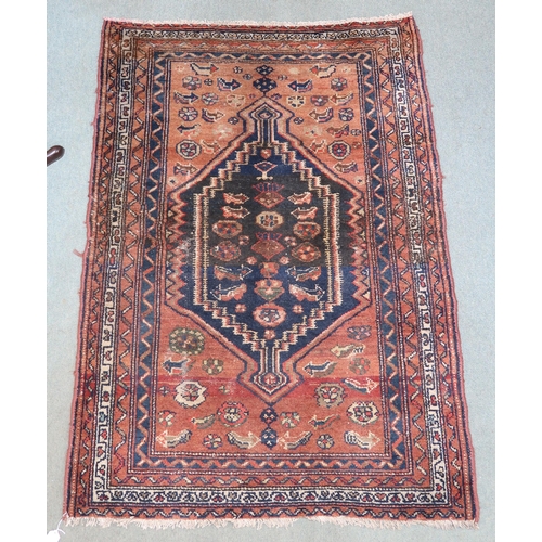 38 - A beige ground Hamadan rug with dark blue central medallion and multiple borders, 151cm long x 112cm... 