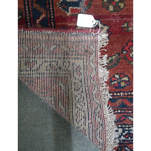 38 - A beige ground Hamadan rug with dark blue central medallion and multiple borders, 151cm long x 112cm... 