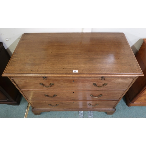 42 - A Georgian mahogany three drawer chest on bracket feet, 99cm high x 111cm wide x 56cm deep