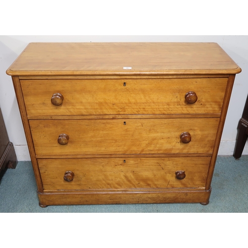 45 - A Victorian pine three drawer chest with turned handles on bun feet, 92cm high x 111cm wide x 45cm d... 