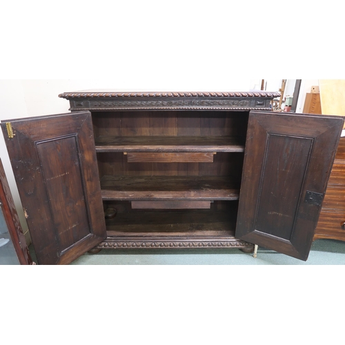 48 - A Victorian stained oak two door cabinet, 133cm high x 148cm wide x 58cm deep