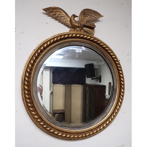 5 - A 20th century gilt framed circular wall mirror with eagle surmount