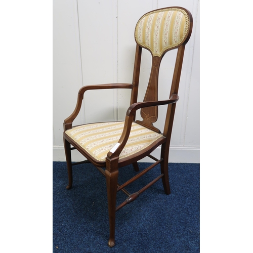 55 - An Edwardian mahogany high back armchair on stretchered cabriole supports, 108cm high