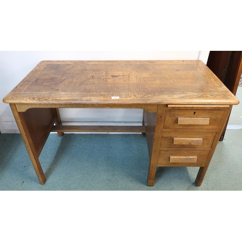 78 - A 20th century oak writing desk, 72cm high x 122cm wide x 60cm deep