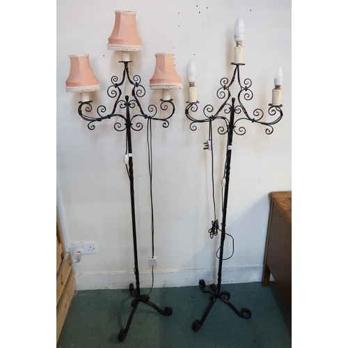 81 - A pair of 20th century wrought iron three branch standard lamps, brass table lamp and a leather suit... 