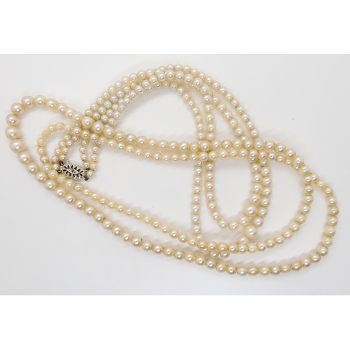 621 - A double string of pearls with a 9ct white gold diamond set clasp, length of shortest length 42cm, t... 