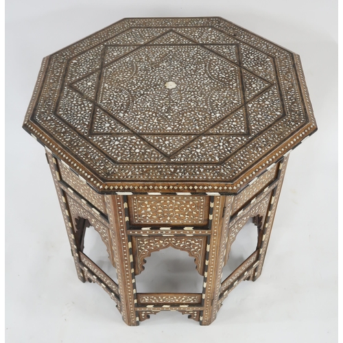 20 - A MIDDLE EASTERN MOORISH EBONY AND BONE INLAID OCTAGONAL TABLEextensively inlaid to top and side wit... 