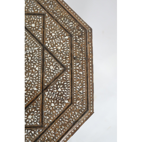 20 - A MIDDLE EASTERN MOORISH EBONY AND BONE INLAID OCTAGONAL TABLEextensively inlaid to top and side wit... 