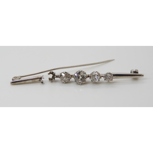 657 - FOUR OLD CUT DIAMONDSset in a broken white metal brooch. the four diamonds are estimated approx, lar... 