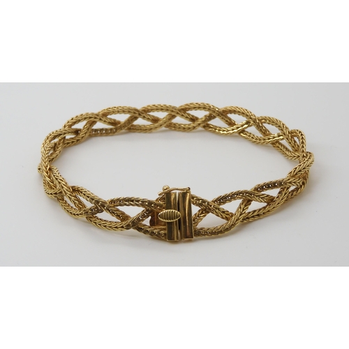 659 - AN 18CT GOLD ITALIAN MADE PLAITED BRACELETmade from three strands of herringbone chain, with Italian... 