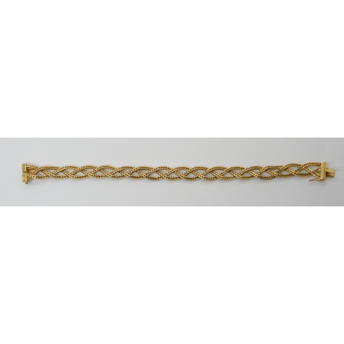 659 - AN 18CT GOLD ITALIAN MADE PLAITED BRACELETmade from three strands of herringbone chain, with Italian... 