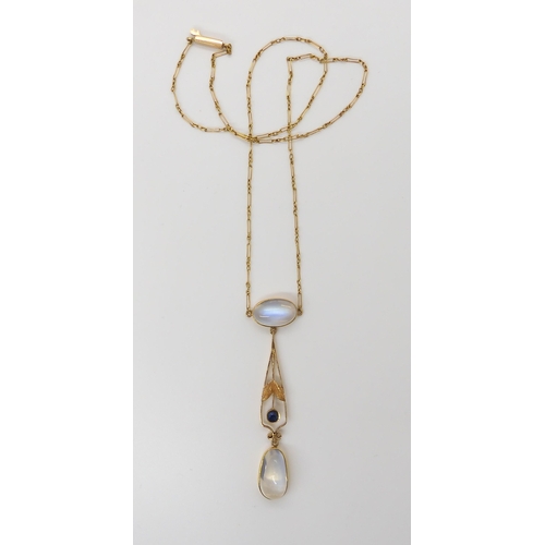 661 - AN 18CT GOLD EDWARDIAN MOONSTONE NECKLETthe pendant further set with a sapphire. The largest moonsto... 