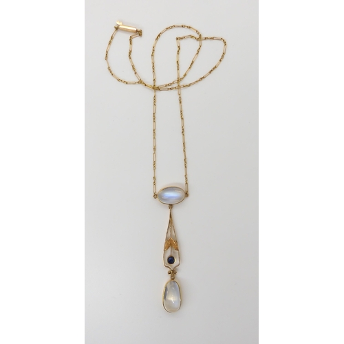 661 - AN 18CT GOLD EDWARDIAN MOONSTONE NECKLETthe pendant further set with a sapphire. The largest moonsto... 