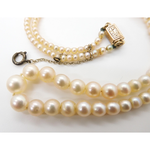 664 - A STRING OF GOOD QUALITY PEARLSwith a yellow and white metal diamond clasp, the largest pearl is 7mm... 