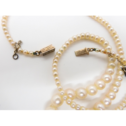 664 - A STRING OF GOOD QUALITY PEARLSwith a yellow and white metal diamond clasp, the largest pearl is 7mm... 