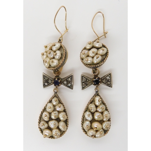 667 - A PAIR OF PEARL DROP EARRINGSset in yellow and white metal throughout, with diamond and sapphire bow... 