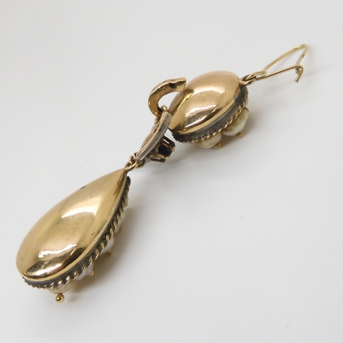 667 - A PAIR OF PEARL DROP EARRINGSset in yellow and white metal throughout, with diamond and sapphire bow... 