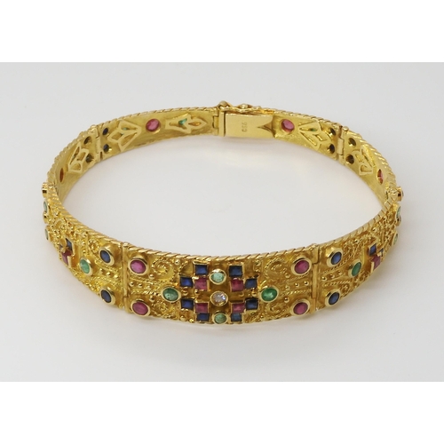 675 - AN EMERALD, RUBY, SAPPHIRE AND DIAMOND BRACELETwith a decorative granulation and twisted wire work g... 
