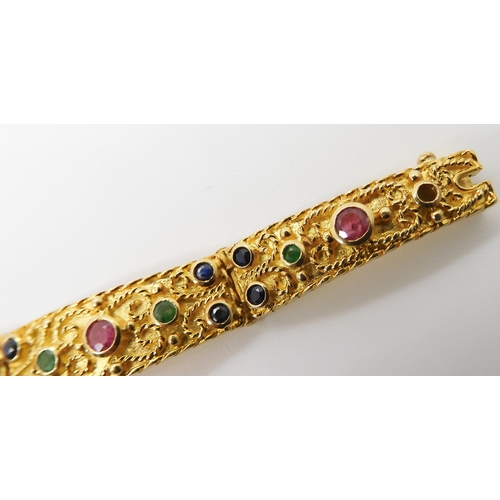 675 - AN EMERALD, RUBY, SAPPHIRE AND DIAMOND BRACELETwith a decorative granulation and twisted wire work g... 