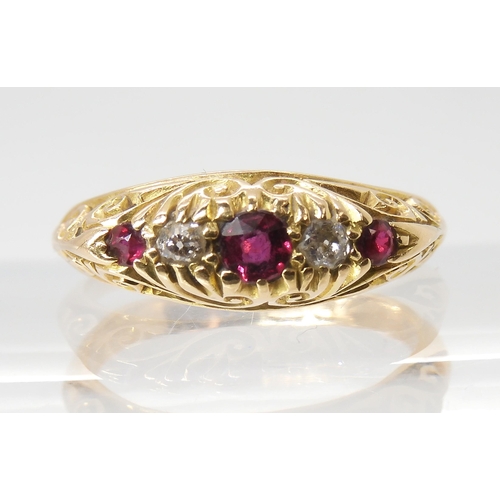 680 - AN 18CT GOLD RUBY AND DIAMOND RINGin a traditional scroll mount, finger size L, weight 4.5gms... 