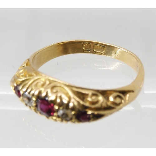 680 - AN 18CT GOLD RUBY AND DIAMOND RINGin a traditional scroll mount, finger size L, weight 4.5gms... 