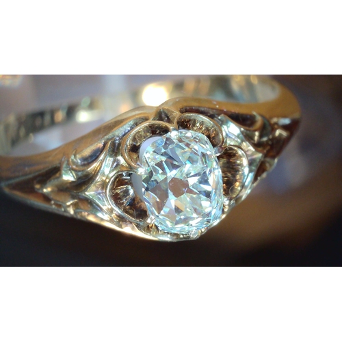 687 - A VINTAGE DIAMOND SOLITAIREset with a cushion cut old cut diamond, with an estimated approx carat we... 