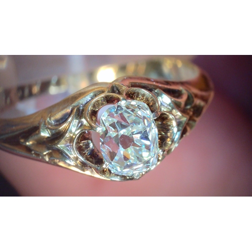 687 - A VINTAGE DIAMOND SOLITAIREset with a cushion cut old cut diamond, with an estimated approx carat we... 