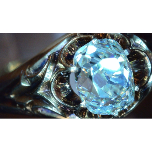 687 - A VINTAGE DIAMOND SOLITAIREset with a cushion cut old cut diamond, with an estimated approx carat we... 