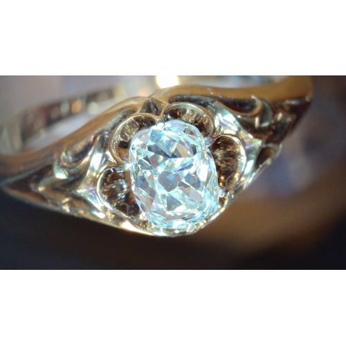 687 - A VINTAGE DIAMOND SOLITAIREset with a cushion cut old cut diamond, with an estimated approx carat we... 