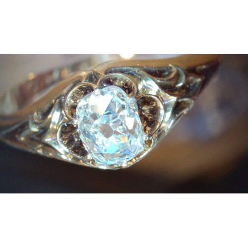 687 - A VINTAGE DIAMOND SOLITAIREset with a cushion cut old cut diamond, with an estimated approx carat we... 