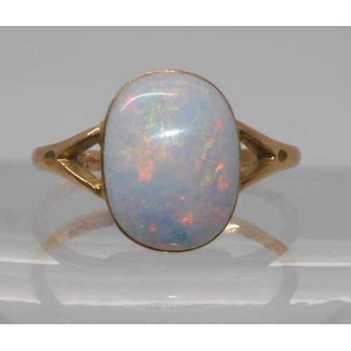 688 - A 9CT GOLD OPAL RINGset with a lively white opal of approx 12.2mm x 9.3mm. Finger size P1/2, weight ... 