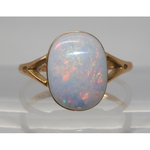 688 - A 9CT GOLD OPAL RINGset with a lively white opal of approx 12.2mm x 9.3mm. Finger size P1/2, weight ... 