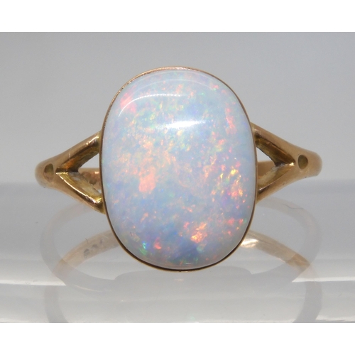 688 - A 9CT GOLD OPAL RINGset with a lively white opal of approx 12.2mm x 9.3mm. Finger size P1/2, weight ... 