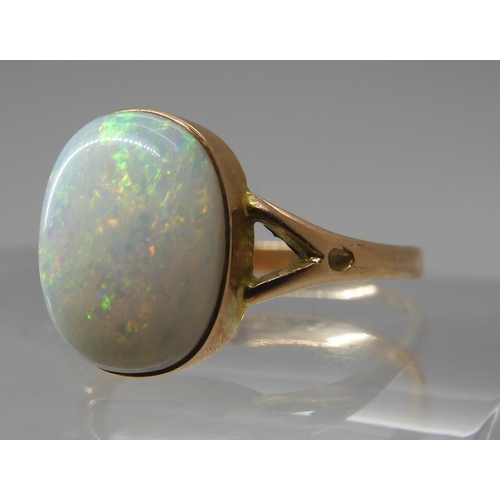 688 - A 9CT GOLD OPAL RINGset with a lively white opal of approx 12.2mm x 9.3mm. Finger size P1/2, weight ... 