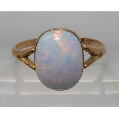 688 - A 9CT GOLD OPAL RINGset with a lively white opal of approx 12.2mm x 9.3mm. Finger size P1/2, weight ... 