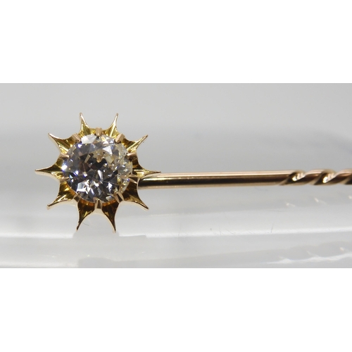 689 - A BOXED DIAMOND TOPPED SUNBURST PINthat also converts to a shirt stud, set with an estimated approx ... 