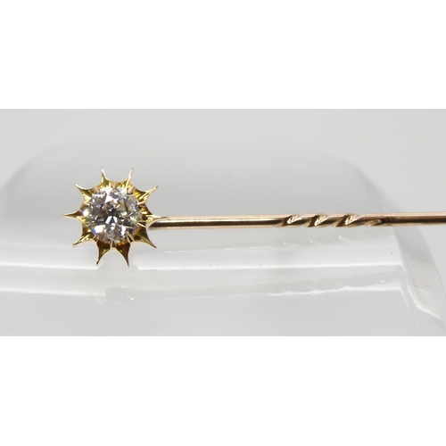 689 - A BOXED DIAMOND TOPPED SUNBURST PINthat also converts to a shirt stud, set with an estimated approx ... 