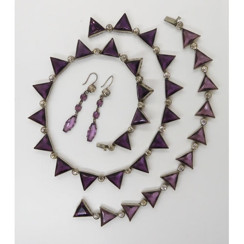 698 - A VINTAGE PURPLE GLASS SUITE OF JEWELLERYcomprising of a necklace with matching bracelet, and simila... 