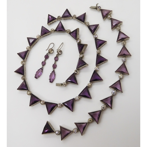 698 - A VINTAGE PURPLE GLASS SUITE OF JEWELLERYcomprising of a necklace with matching bracelet, and simila... 