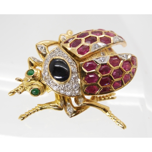 704 - A RUBY, SAPPHIRE, & DIAMOND BEETLE BROOCHwith emerald eyes. With articulated legs, head and wing... 