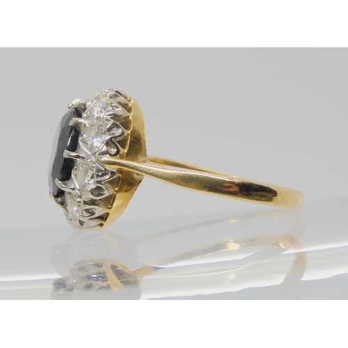 709 - AN 18CT GOLD SAPPHIRE AND DIAMOND RINGsapphire approx 9.1mm, surrounded with estimated approx 0.50ct... 